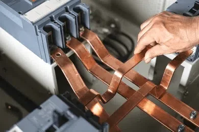 imgi_105_technician-assembling-busbars-electrical-cabinets-260nw-2354276075
