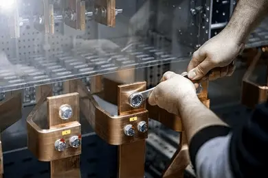 imgi_112_unrecognizable-man-squeezing-copper-busbar-260nw-2049484973